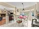 Eat-in kitchen features a breakfast nook area with an island, granite countertops, tile flooring and neutral paint colors at 1083 Wash Lee Sw Dr, Lilburn, GA 30047