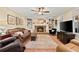 Inviting living room with fireplace, built-in shelving, and plenty of natural light at 1083 Wash Lee Sw Dr, Lilburn, GA 30047