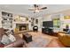 Cozy living room features a brick fireplace and built-in shelving units at 1083 Wash Lee Sw Dr, Lilburn, GA 30047