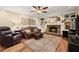 Comfortable living room with fireplace, built-in shelves, and hardwood floors at 1083 Wash Lee Sw Dr, Lilburn, GA 30047