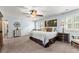 Bright main bedroom features soft carpeting and an attached sitting area at 1083 Wash Lee Sw Dr, Lilburn, GA 30047