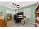 Functional home office featuring a modern desk, built-in shelves and natural light at 1083 Wash Lee Sw Dr, Lilburn, GA 30047