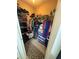 Walk-in closet with wire shelving and lots of storage for folded and hung clothing at 2331 Georgia Lane, Snellville, GA 30078