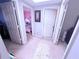 Hallway view into a pink bedroom and a utility closet with gray walls and neutral carpeting at 2331 Georgia Lane, Snellville, GA 30078