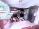 Bright kitchen featuring stainless steel appliances, dark cabinets, granite counters, and tile flooring at 2331 Georgia Lane, Snellville, GA 30078