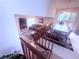 Open-concept living and dining area with fireplace, plush seating, and natural light at 2331 Georgia Lane, Snellville, GA 30078