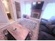 Comfortable living room featuring a fireplace, TV, and a cozy couch for relaxation at 2331 Georgia Lane, Snellville, GA 30078