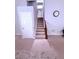 Carpeted staircase leading to the upper level of the home with neutral decor at 2331 Georgia Lane, Snellville, GA 30078