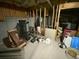 Basement with exposed insulation, personal items and laundry at 5390 Regency Lake Court, Sugar Hill, GA 30518