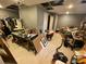 Basement with concrete floor and exposed ceiling, filled with personal items and a vacuum at 5390 Regency Lake Court, Sugar Hill, GA 30518