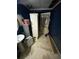 Bathroom with blue walls, sink, and storage at 5390 Regency Lake Court, Sugar Hill, GA 30518