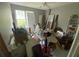 Bedroom filled with personal items, natural light, and a ceiling fan at 5390 Regency Lake Court, Sugar Hill, GA 30518