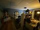 Bedroom illuminated with a ceiling light, featuring a bed, desk, and ambient lighting at 5390 Regency Lake Court, Sugar Hill, GA 30518