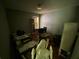 View of a dark bedroom featuring a desk, chairs, and some furniture at 5390 Regency Lake Court, Sugar Hill, GA 30518