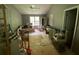 Bedroom with a ceiling fan, furniture, and natural light at 5390 Regency Lake Court, Sugar Hill, GA 30518