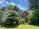 Charming two-story home with brick accents and a landscaped front yard at 5390 Regency Lake Court, Sugar Hill, GA 30518