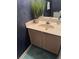 Compact powder room featuring modern sink fixtures, vanity and decorative accents at 6438 Wedgeview Dr, Tucker, GA 30084