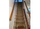 Carpeted stairway with wooden handrails, providing safe and stylish access to the upper level at 6438 Wedgeview Dr, Tucker, GA 30084