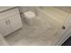 Bright bathroom with marble-style floors, a new toilet, and a modern vanity at 1321 Bridges Sw Ave, Atlanta, GA 30310