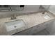 Bathroom featuring double sinks and granite countertop with modern faucets at 1321 Bridges Sw Ave, Atlanta, GA 30310