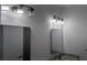 Bathroom with double vanity, modern lighting, and framed mirrors that add a touch of elegance at 1321 Bridges Sw Ave, Atlanta, GA 30310