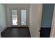 Entryway leading to a wooden deck through glass doors and a view to another room at 1321 Bridges Sw Ave, Atlanta, GA 30310