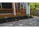 Charming front porch featuring fresh gravel and manicured landscaping at 1321 Bridges Sw Ave, Atlanta, GA 30310