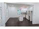 Open-concept space featuring a modern kitchen with an island and stainless steel appliances at 1321 Bridges Sw Ave, Atlanta, GA 30310