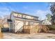 Exterior view of a home with a spacious backyard, a wooden deck, and a paved driveway at 1450 Elizabeth Ln, Atlanta, GA 30344