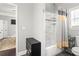 Bathroom with a combination shower and tub with a tile surround at 1450 Elizabeth Ln, Atlanta, GA 30344