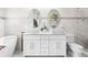 Bathroom featuring double vanity with modern square sinks, a soaking tub and neutral tones at 1450 Elizabeth Ln, Atlanta, GA 30344