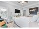Beautiful bedroom with a luxury bed, mounted tv, horse artwork and ensuite bathroom at 1450 Elizabeth Ln, Atlanta, GA 30344