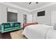 Bedroom featuring wood floors, a sitting area and neutral colors with a television at 1450 Elizabeth Ln, Atlanta, GA 30344