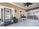 Inviting front porch with stylish seating, a unique front door, and manicured landscaping at 1450 Elizabeth Ln, Atlanta, GA 30344