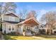 Charming two-story home with a covered porch and a lush green lawn at 1450 Elizabeth Ln, Atlanta, GA 30344