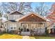 Charming home with a well-manicured lawn, a covered porch, and beautiful landscaping at 1450 Elizabeth Ln, Atlanta, GA 30344