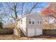 Exterior view of a detached two-car garage with a small apartment above it at 1450 Elizabeth Ln, Atlanta, GA 30344