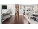 Open-concept living space with hardwood floors seamlessly connecting the living and dining areas at 1450 Elizabeth Ln, Atlanta, GA 30344