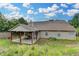 Expansive backyard with covered patio, offering a peaceful outdoor space at 1627 Amhearst Walk Rd, Lawrenceville, GA 30043