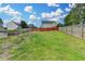 Spacious, grassy backyard with a wood privacy fence at 1627 Amhearst Walk Rd, Lawrenceville, GA 30043