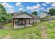 A sprawling backyard featuring a covered patio area at 1627 Amhearst Walk Rd, Lawrenceville, GA 30043