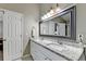 Bright bathroom features a double sink vanity and granite countertop at 1627 Amhearst Walk Rd, Lawrenceville, GA 30043