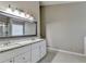 Bathroom vanity with double sinks and a large framed mirror at 1627 Amhearst Walk Rd, Lawrenceville, GA 30043