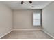 Empty bedroom featuring neutral paint, carpet, and a bright window at 1627 Amhearst Walk Rd, Lawrenceville, GA 30043