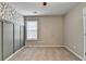 Carpeted bedroom featuring stylish accent wall, neutral paint, and a bright window at 1627 Amhearst Walk Rd, Lawrenceville, GA 30043