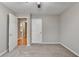 Carpeted bedroom featuring neutral paint and an open door to a bathroom at 1627 Amhearst Walk Rd, Lawrenceville, GA 30043