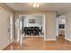 Open-concept dining room with hardwood floors, seating for eight, and lots of natural light at 1627 Amhearst Walk Rd, Lawrenceville, GA 30043