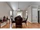 Dining room featuring hardwood floors and a view into the foyer at 1627 Amhearst Walk Rd, Lawrenceville, GA 30043