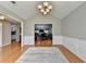 Dining room featuring hardwood floors, white trim, and view into other living spaces at 1627 Amhearst Walk Rd, Lawrenceville, GA 30043