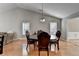 Dining room featuring hardwood floors with views to the living and dining room at 1627 Amhearst Walk Rd, Lawrenceville, GA 30043